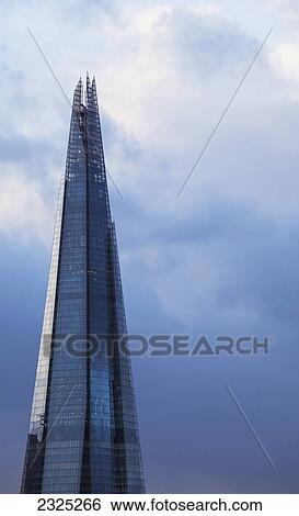 Stock Photograph - UK, England, View of Shard pinnacle at dusk; London. Fotosearch