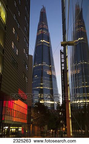 Stock Image - UK, England, View of Shard skyscraper at dusk; London. Fotosearch