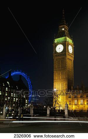 Stock Photograph - UK, England, Views of London Eye and Big Ben at night; London. Fotosearch