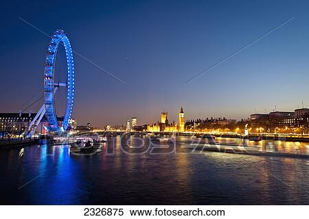 Stock Photography - UK, England, Views of London Eye and Westminster at night; London. Fotosearch