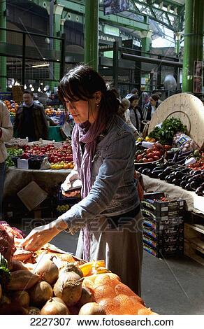 UK, England, Young woman shopping at Borough Market; London View Large Photo Image Stock Photo - UK, England, Young woman shopping at Borough Market; London. Fotosearch