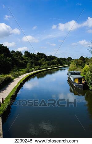 Stock Photography - UK., Hertfordshire, and lush green surrounding countryside; Hemel Hempstead, barge, towpath, The Grand Union Canal. Fotosearch