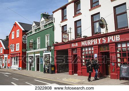 Stock Photo - UK, Ireland, County Kerry, Dingle, Colorful Irish pubs. Fotosearch