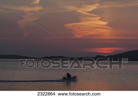 Picture - UK, Ireland, County Kerry, Iveragh Peninsula, Cahersiveen, Sunset at Reenard Point looking across to Valentia Island. Fotosearch
