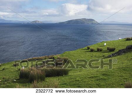 UK, Ireland, County Kerry, Iveragh Peninsula, View across Ballinskelligs bay to Scariff and Deenish Islands View Large Photo Image Stock Image - UK, Ireland, County Kerry, Iveragh Peninsula, View across Ballinskelligs bay to Scariff and Deenish Islands. Fotosearch
