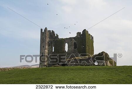 Stock Image - UK, Ireland, County Kerry, Iveragh Peninsula, Cahersiveen, Cahersiveen, Ballycarbery Castle on Ring of Kerry. Fotosearch
