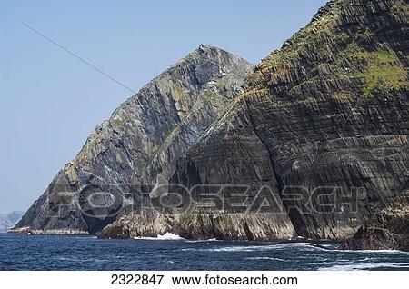 Stock Photo - UK, Ireland, County Kerry, Iveragh Peninsula, Coastline of Puffin Island. Fotosearch