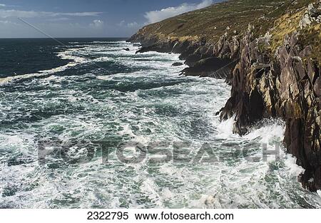 Stock Photography - UK, Ireland, County Kerry, Ring of Skelligs, Ballinskelligs, Waves crashing against Bolus Head. Fotosearch