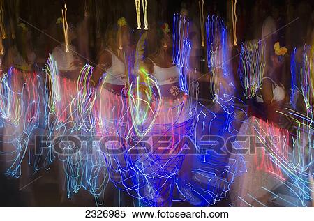 Stock Photography - UK, Ladies parading and waving flash torch led wands; London. Fotosearch