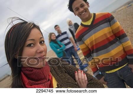 Stock Photography - UK, Mixed group of teenagers at seaside; Hastings. Fotosearch