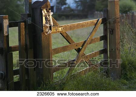 Stock Photography - UK, North Devon, Fence at sunset; Lee. Fotosearch