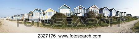 Stock Photograph - UK, Panoramic view of beach huts; Dorset. Fotosearch