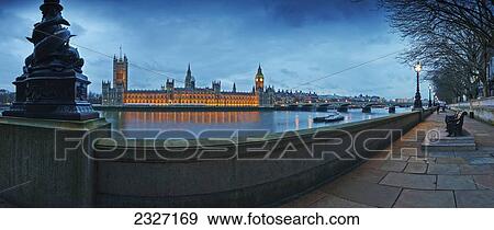 Stock Photo - UK, Panoramic view of Houses of Parliament at dusk from River Thames; London. Fotosearch