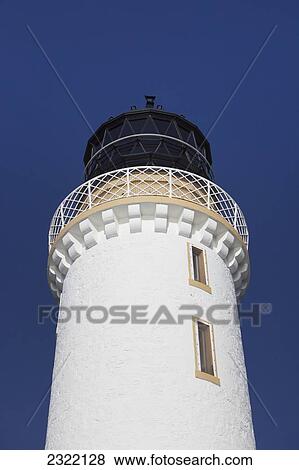 Stock Photo - UK, Scotland, Dumfries and Galloway, Low angle view of lighthouse against blue sky. Fotosearch