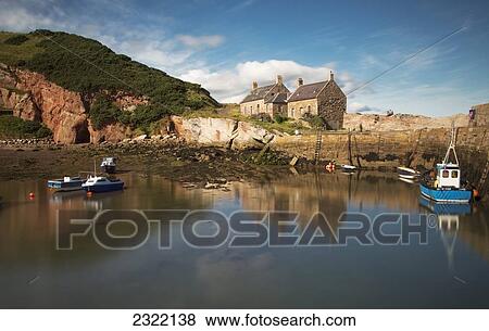 UK, Scotland, Scottish Borders, Cove, Fishing boats in harbour with houses on shore View Large Photo Image Stock Photo - UK, Scotland, Scottish Borders, Cove, Fishing boats in harbour with houses on shore. Fotosearch