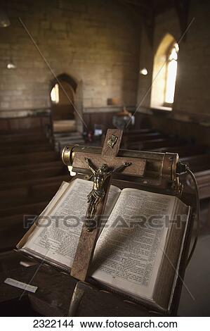 Picture - UK, Scotland, Scottish Borders, Yetholm, Open bible on stand with a crucifix. Fotosearch