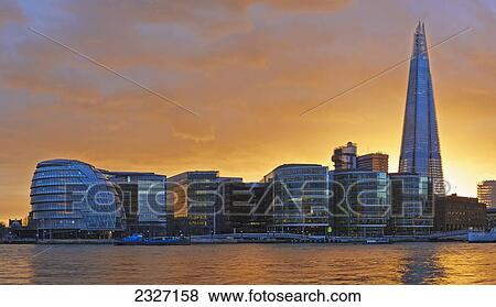 Stock Photo - UK, Shard and City Hall from banks of river Thames; London. Fotosearch
