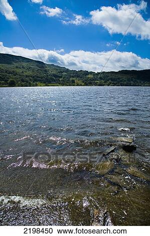 UK, Wales, North Wales, Snowdonia National Park, Lake Nant Gwynant glistening in sunlight near Llyn Gwynant Campsite; Nant Gwynant View Large Photo Image Stock Image - UK, Wales, North Wales, Snowdonia National Park, Lake Nant Gwynant glistening in sunlight near Llyn Gwynant Campsite; Nant Gwynant. Fotosearch