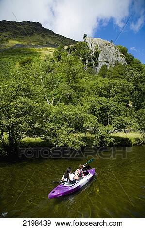 Stock Photo - UK, Wales, North Wales, Snowdonia National Park, Elevated view of people kayaking near Llyn Gwynant Campsite; Nant Ggwynant. Fotosearch