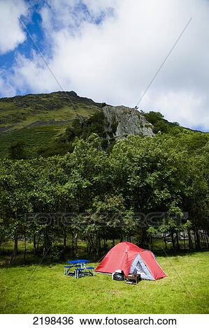 UK, Wales, North Wales, Snowdonia National Park, surrounded by hillsides at Llyn Gwynant Campsite; Nant Ggwynant, Tents in valley campsite View Large Photo Image Stock Photograph - UK, Wales, North Wales, Snowdonia National Park, surrounded by hillsides at Llyn Gwynant Campsite; Nant Ggwynant, Tents in valley campsite. Fotosearch