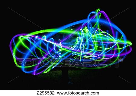 UK, Woman spinning hula-hoop lit with LEDs in field at night; West Sussex View Large Photo Image Stock Image - UK, Woman spinning hula-hoop lit with LEDs in field at night; West Sussex. Fotosearch