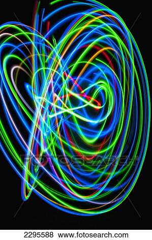UK, Woman spinning hula-hoop lit with LEDs in field at night; West Sussex View Large Photo Image Stock Photo - UK, Woman spinning hula-hoop lit with LEDs in field at night; West Sussex. Fotosearch
