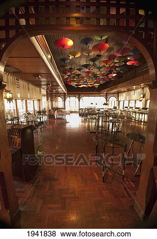Stock Photo - Umbrellas Hanging From The Ceiling At The Restaurant In Amari Rincome Hotel; Chiang Mai Thailand. Fotosearch