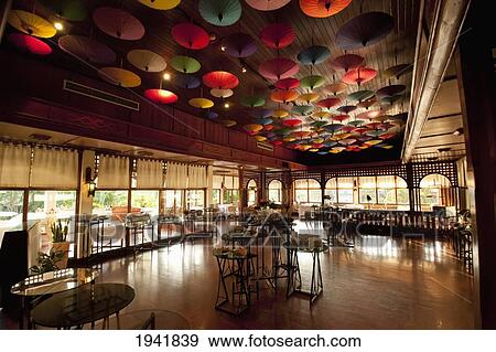 Stock Photo - Umbrellas Hanging From The Ceiling At The Restaurant In Amari Rincome Hotel; Chiang Mai Thailand. Fotosearch