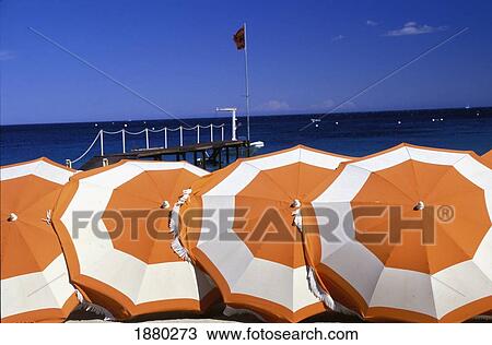 Stock Image - Umbrellas On Pampellone Beach; St. Tropez, France. Fotosearch