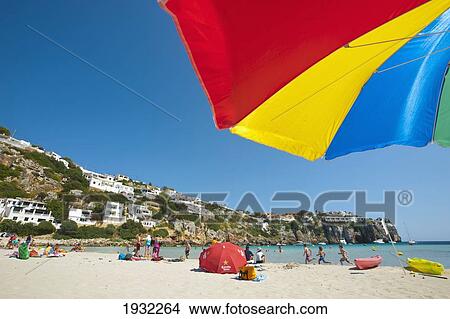 Under The Umbrella In Cala En Porter, Menorca, Balearic Islands, Spain View Large Photo Image Picture - Under The Umbrella In Cala En Porter, Menorca, Balearic Islands, Spain. Fotosearch