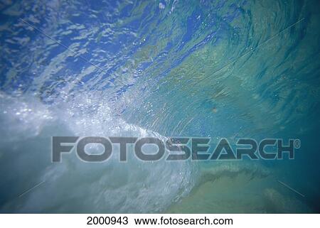 Stock Image - Underwater Translucent Wave Surface Curling Visible Turquoise Green D1689. Fotosearch