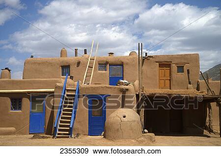Stock Photo - Unique Architecture Of A Two Story Residential Building; Taos Pueblo, New Mexico, United States Of America. Fotosearch