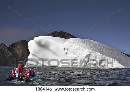 Unique Iceberg And Tourists Off The Coast; Devon Island, Nunavut, Canada View Large Photo Image Stock Photography - Unique Iceberg And Tourists Off The Coast; Devon Island, Nunavut, Canada. Fotosearch