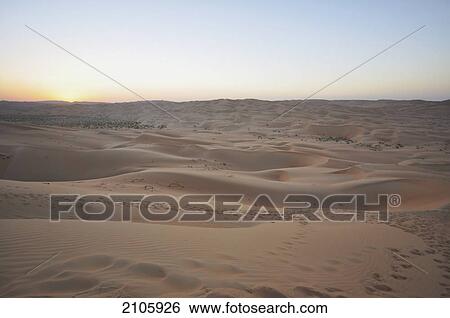 Stock Photograph - United Arab Emirates, Abu Dahbi, Empty Quarter, Liwa desert dune sunset. Fotosearch