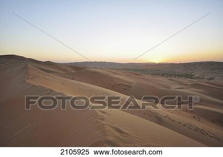 Stock Photography - United Arab Emirates, Abu Dahbi, Empty Quarter, Liwa desert dune sunset. Fotosearch