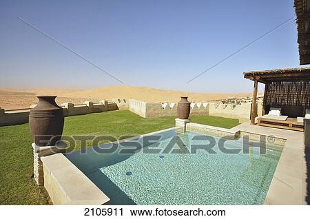 Stock Image - United Arab Emirates, Abu Dahbi, Qasr al Sarab, Poolside villa. Fotosearch