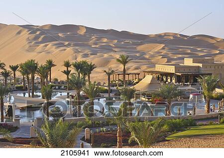 Stock Image - United Arab Emirates, Abu Dahbi, Qasr al Sarab, Qasr al Sarab hotel and dunes. Fotosearch