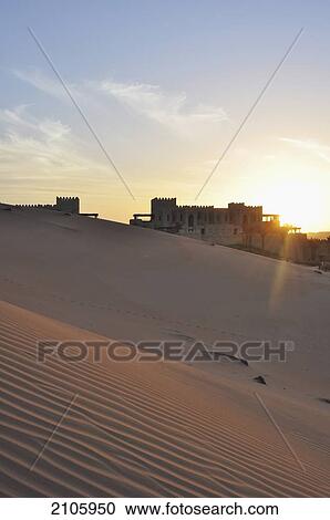 Stock Image - United Arab Emirates, Abu Dahbi, Qasr al Sarab, Empty Quarter, Liwa desert sunset. Fotosearch