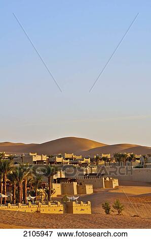 United Arab Emirates, Abu Dahbi, Qasr al Sarab, Liwa desert, Qasr al Sarab hotel with palm trees View Large Photo Image Stock Photo - United Arab Emirates, Abu Dahbi, Qasr al Sarab, Liwa desert, Qasr al Sarab hotel with palm trees. Fotosearch