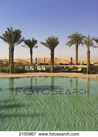 United Arab Emirates, Abu Dahbi, Qasr al Sarab, Main pool and dunes View Large Photo Image Stock Photo - United Arab Emirates, Abu Dahbi, Qasr al Sarab, Main pool and dunes. Fotosearch