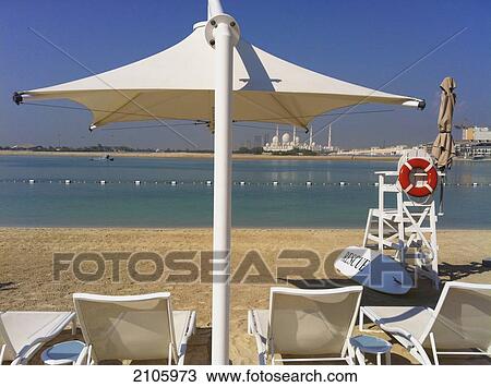 United Arab Emirates, Abu Dahbi, Shangri-la Hotel, Shaikh Zayed Bin Sultan Al Nahyan Mosque in background, Parasol on beach View Large Photo Image Stock Image - United Arab Emirates, Abu Dahbi, Shangri-la Hotel, Shaikh Zayed Bin Sultan Al Nahyan Mosque in background, Parasol on beach. Fotosearch