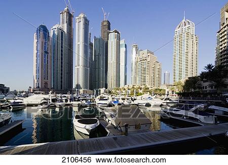 Stock Photograph - United Arab Emirates, View of city marina and skyscrapers; Dubai. Fotosearch