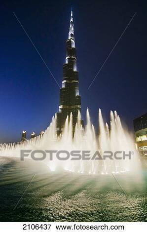 Stock Photo - United Arab Emirates, View of fountain in front of Burj Khalifa hotel; Dubai. Fotosearch