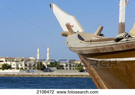 United Arab Emirates, View of sailing boat with city skyline in distance; Ras Al Khaimah View Large Photo Image Stock Image - United Arab Emirates, View of sailing boat with city skyline in distance; Ras Al Khaimah. Fotosearch