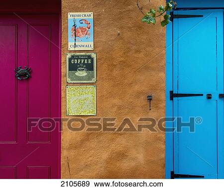 Stock Photo - United Kingdom, England, Cornwall, Colorful shop front doors and signs; Falmouth. Fotosearch
