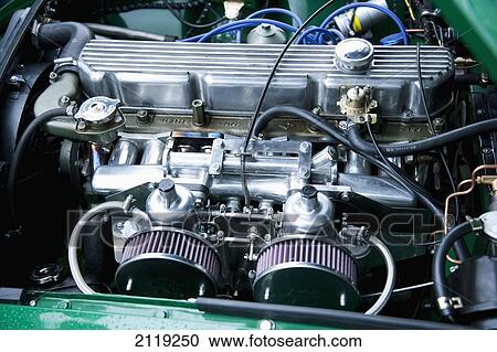 Stock Image - United Kingdom, England, Devon, Close-up of MGB GT engine; Uffculme. Fotosearch