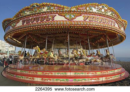 Stock Photography - United Kingdom, England, East Sussex, Carousel on beach; Brighton. Fotosearch