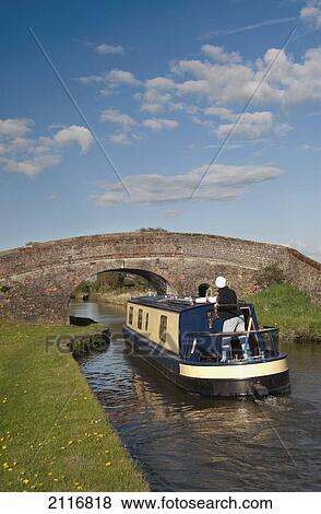 Stock Photo - United Kingdom, England, Llangollen Canal, Narrow Boat Cruising the Canal. Fotosearch