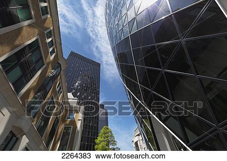 Stock Image - United Kingdom, England, Low angle view of building exteriors; London. Fotosearch