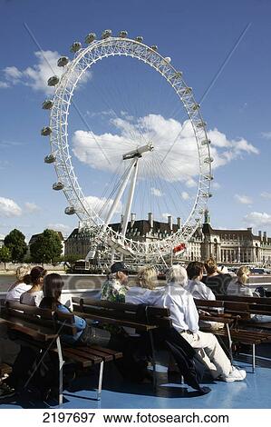Stock Photo - United Kingdom, England, Millennium Wheel Viewed From Thames Cruise Boat; London. Fotosearch